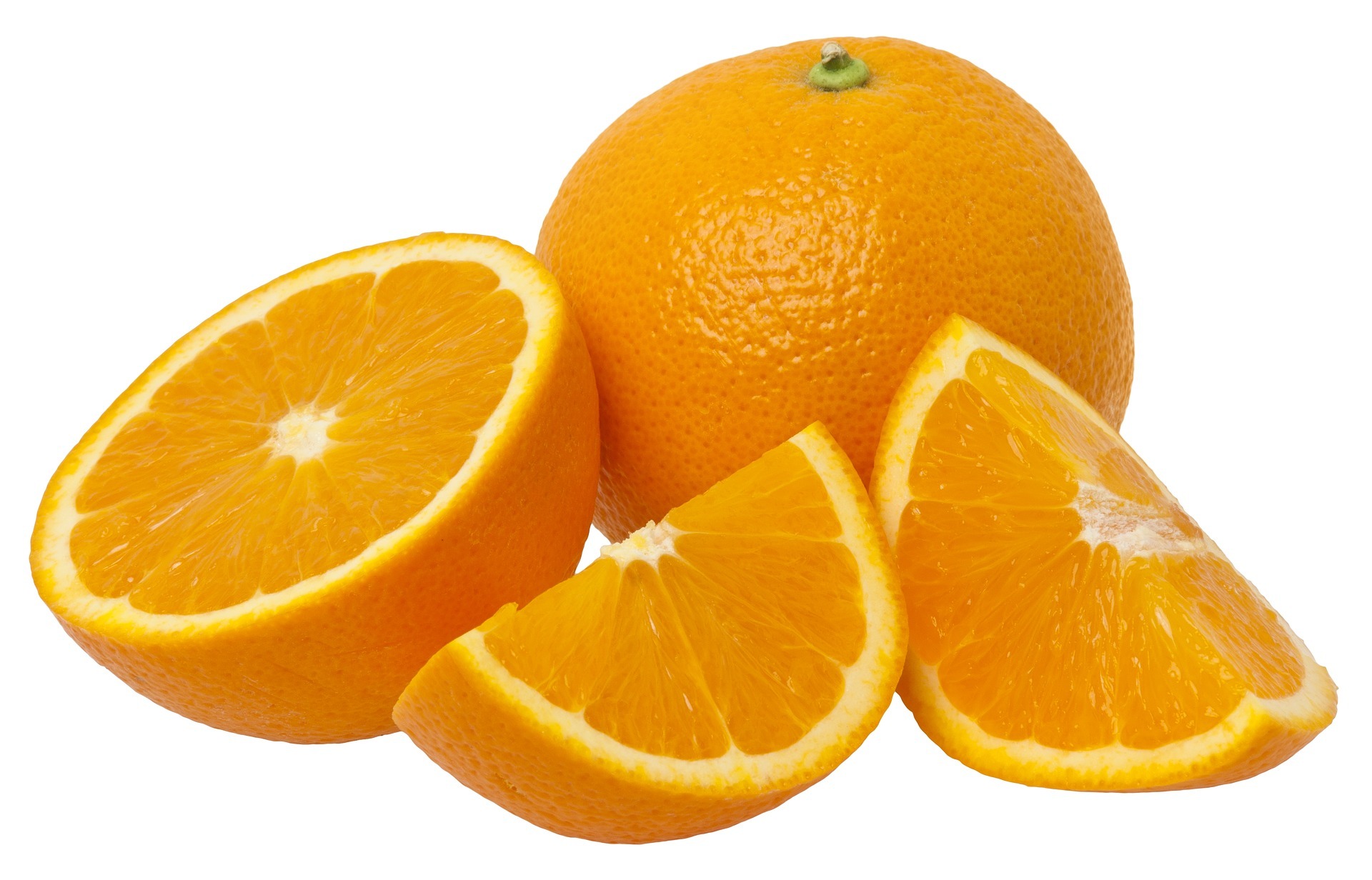 A photo of two oranges with the one in front split into a half and two quarters.  The split orange's flesh is facing forwards.