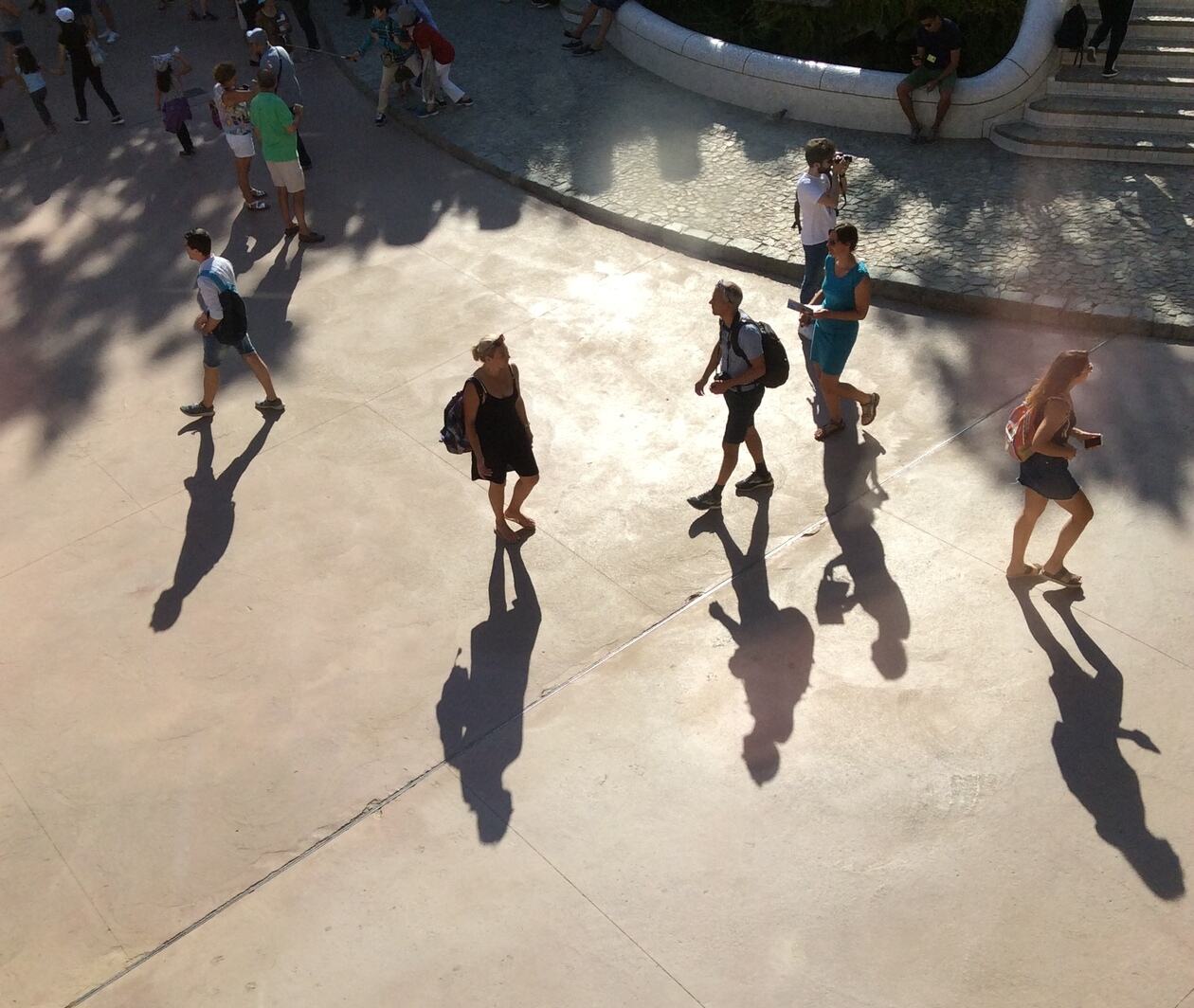 Sunlight shining on people in public outdoor space