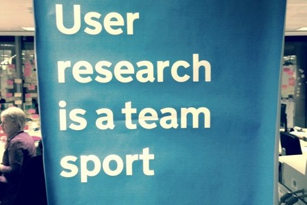 a banner with 'user research is a team sport' written on it