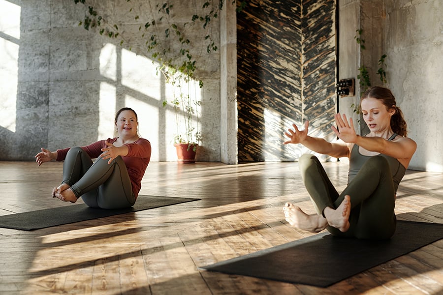 Two women on a mat