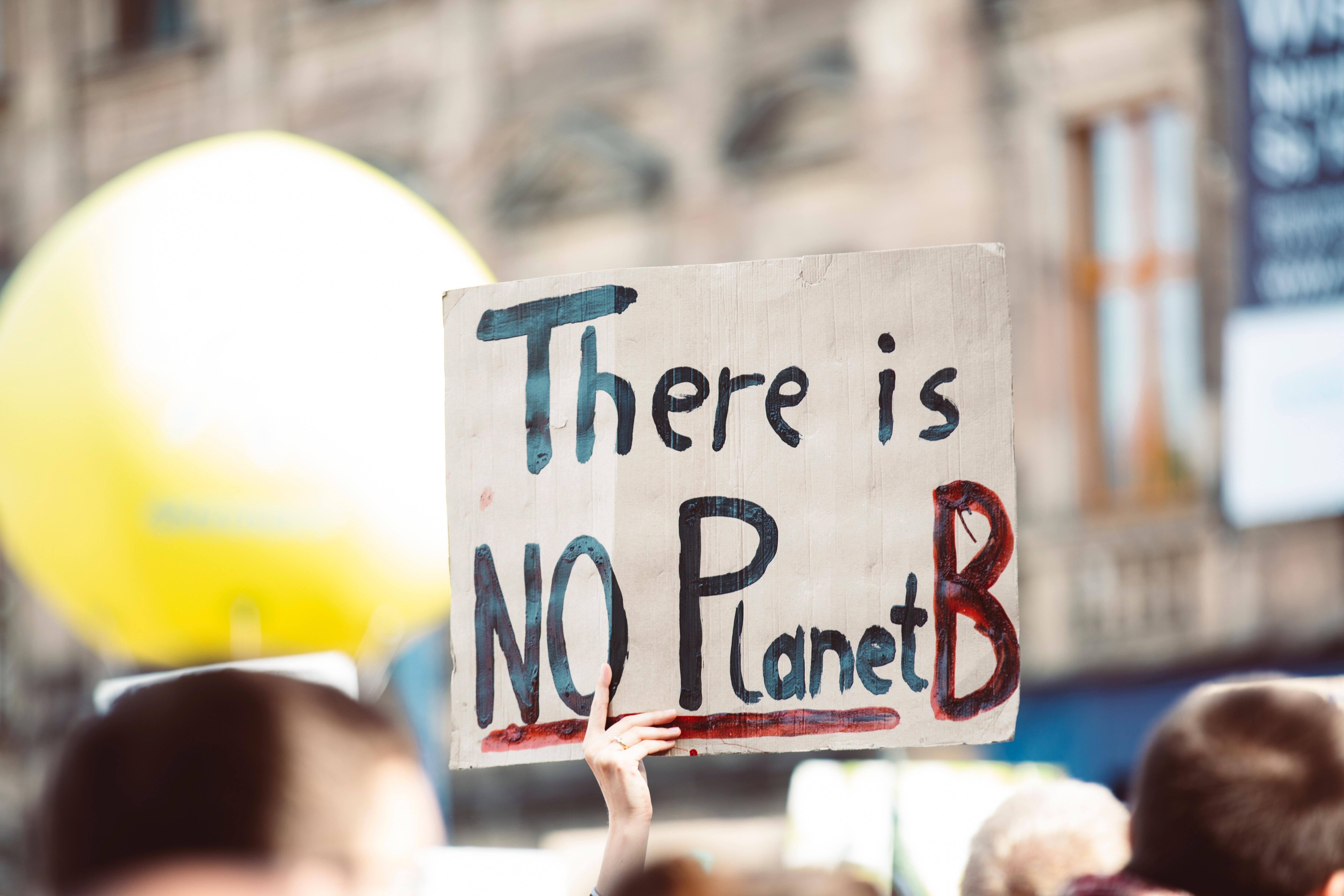 Person holding a banner reading 