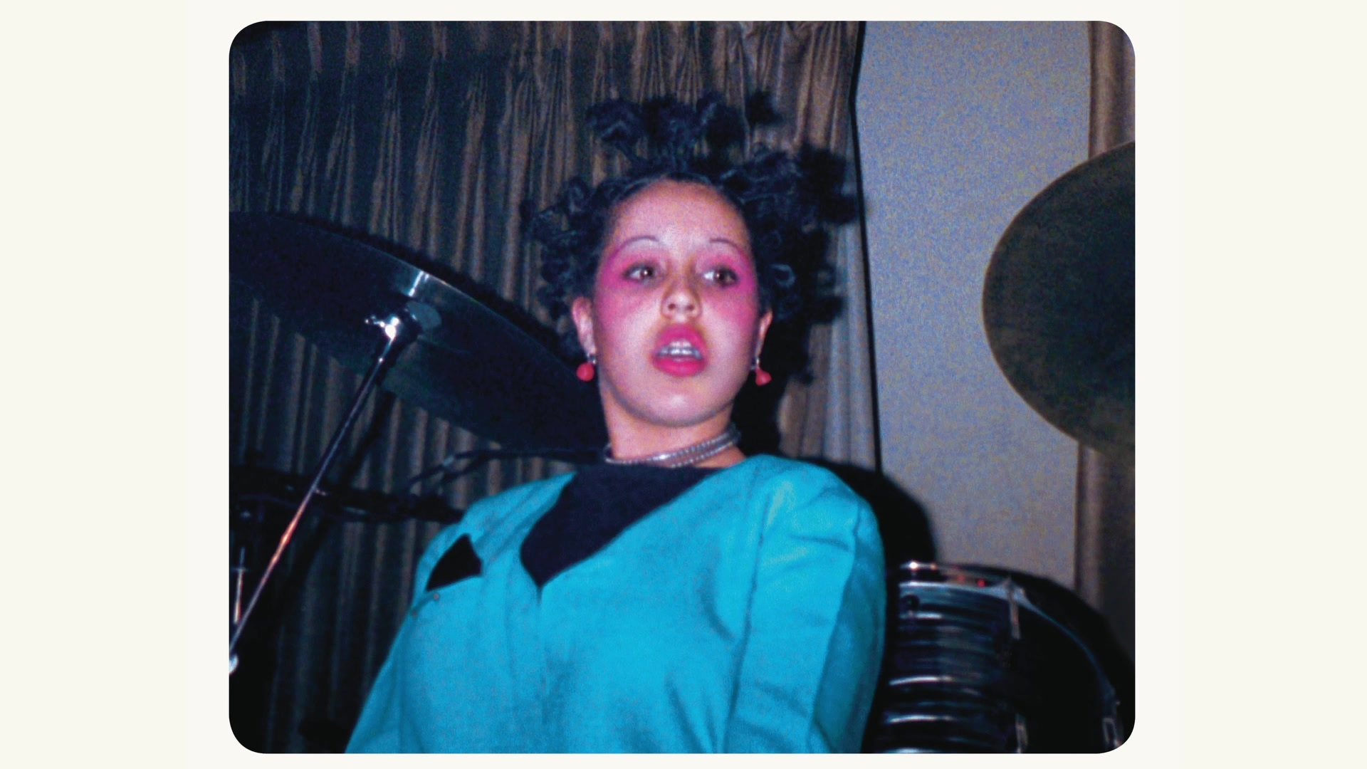 Photo of Poly Styrene on stage