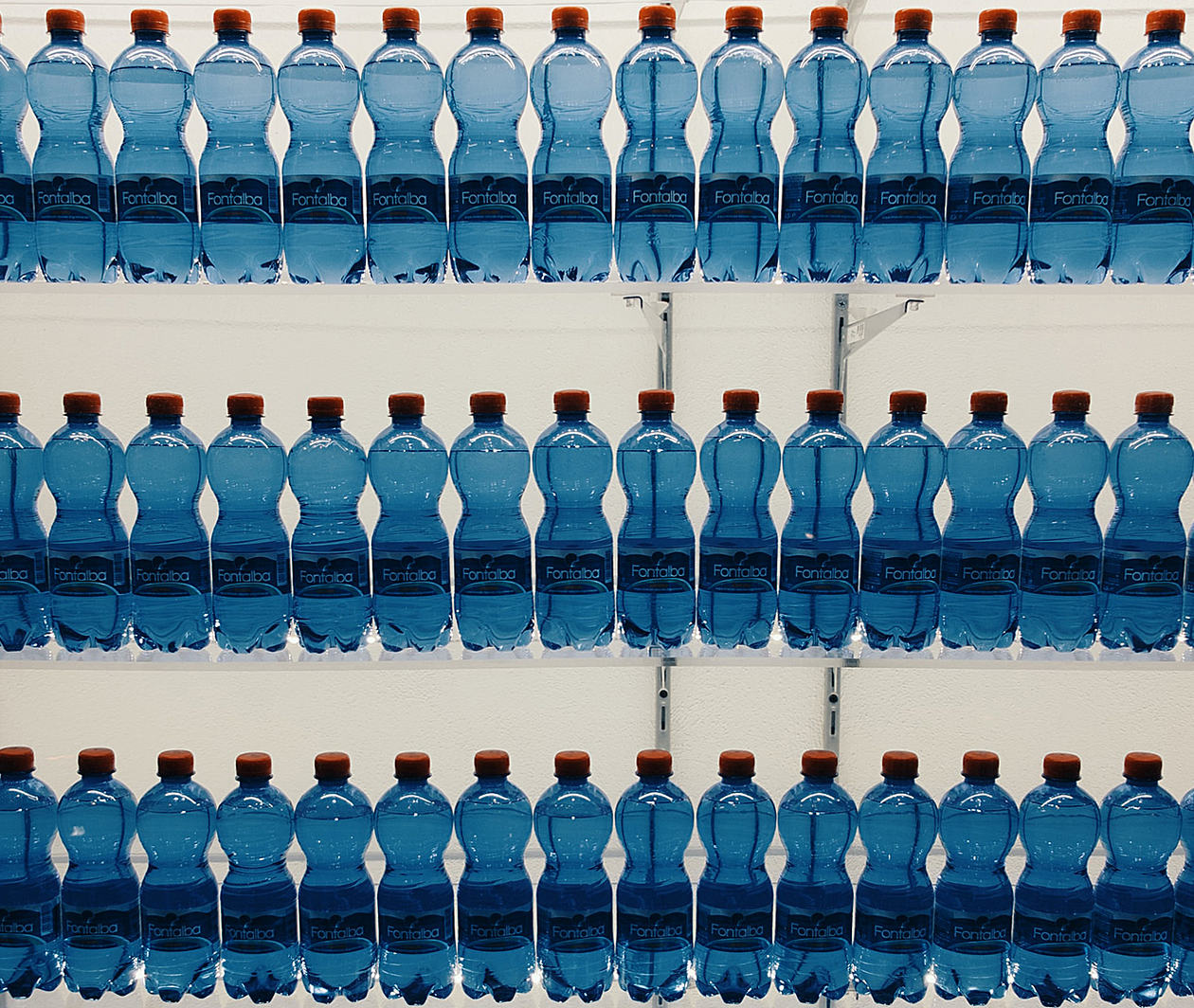 Rows and rows of bottled water on a production line