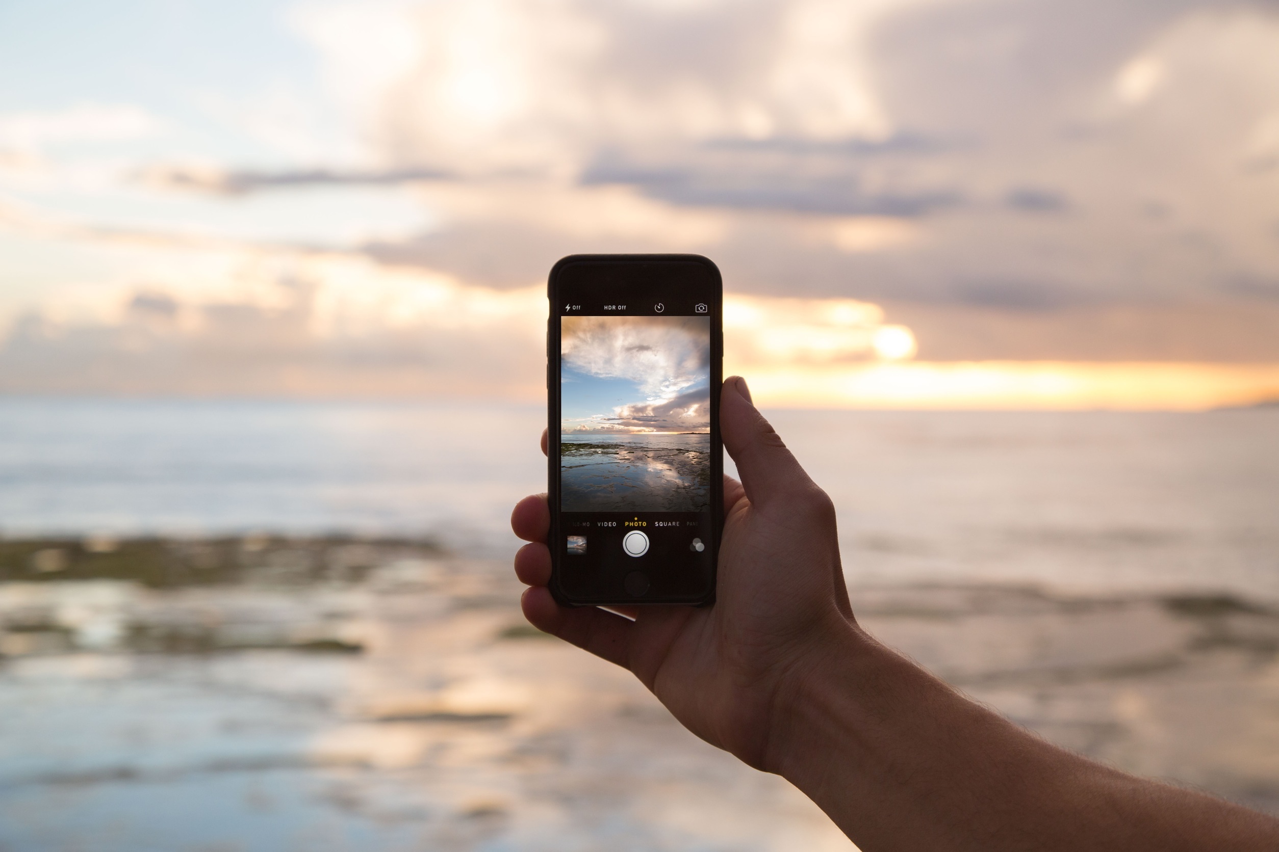 The sea viewed through the screen of a mobile phone.