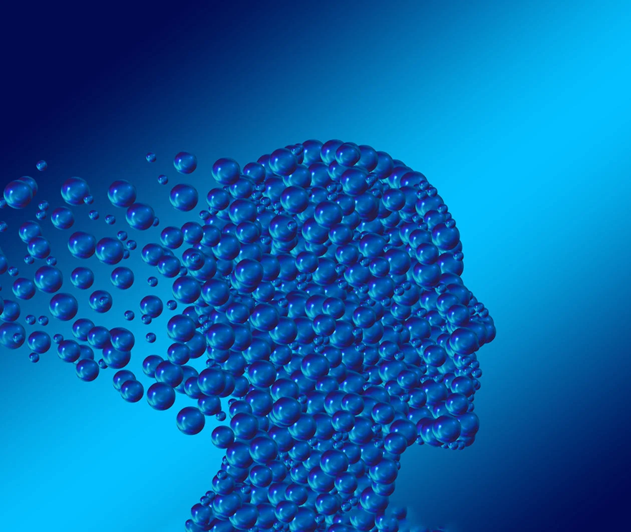 A side profile of a human head formed from blue bubbles