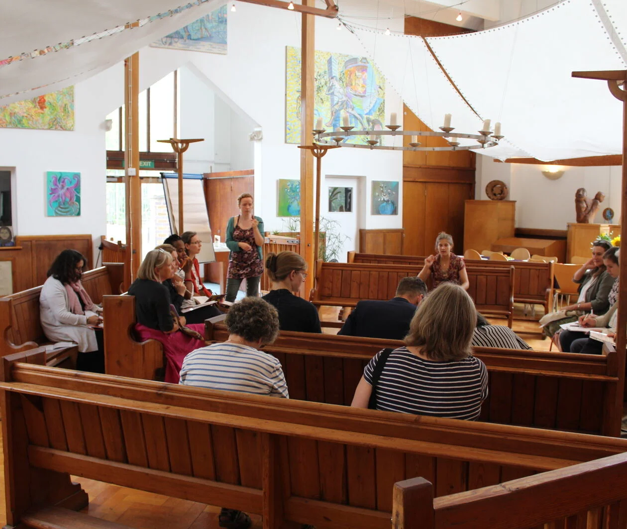 A meeting inside a church which was transformed through community led design