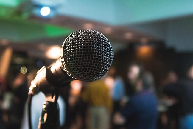 Microphone and blurred people in the background