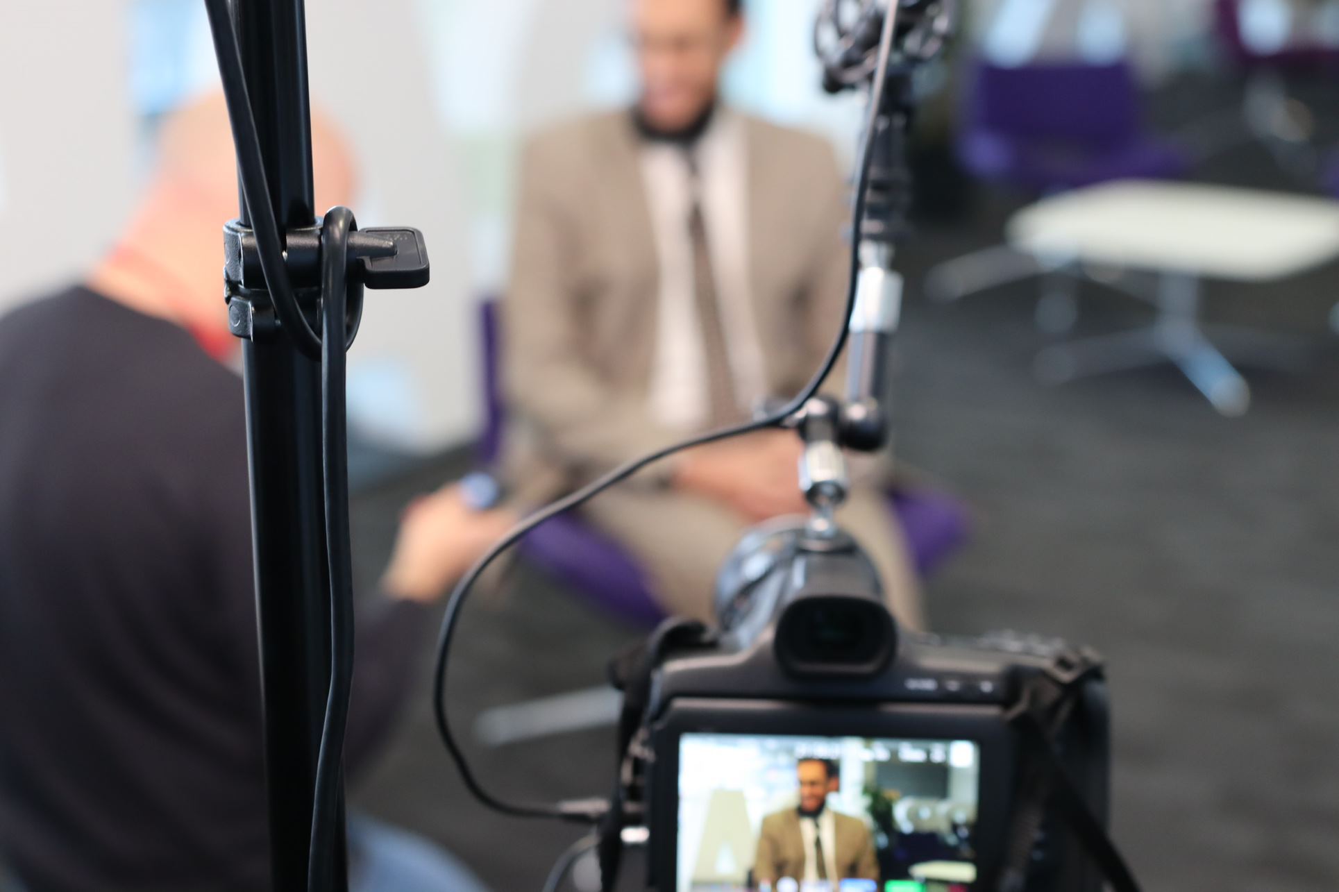 Image of a filming set including Shaykh Dr Asim Yusuf and Andrew Hilbourne