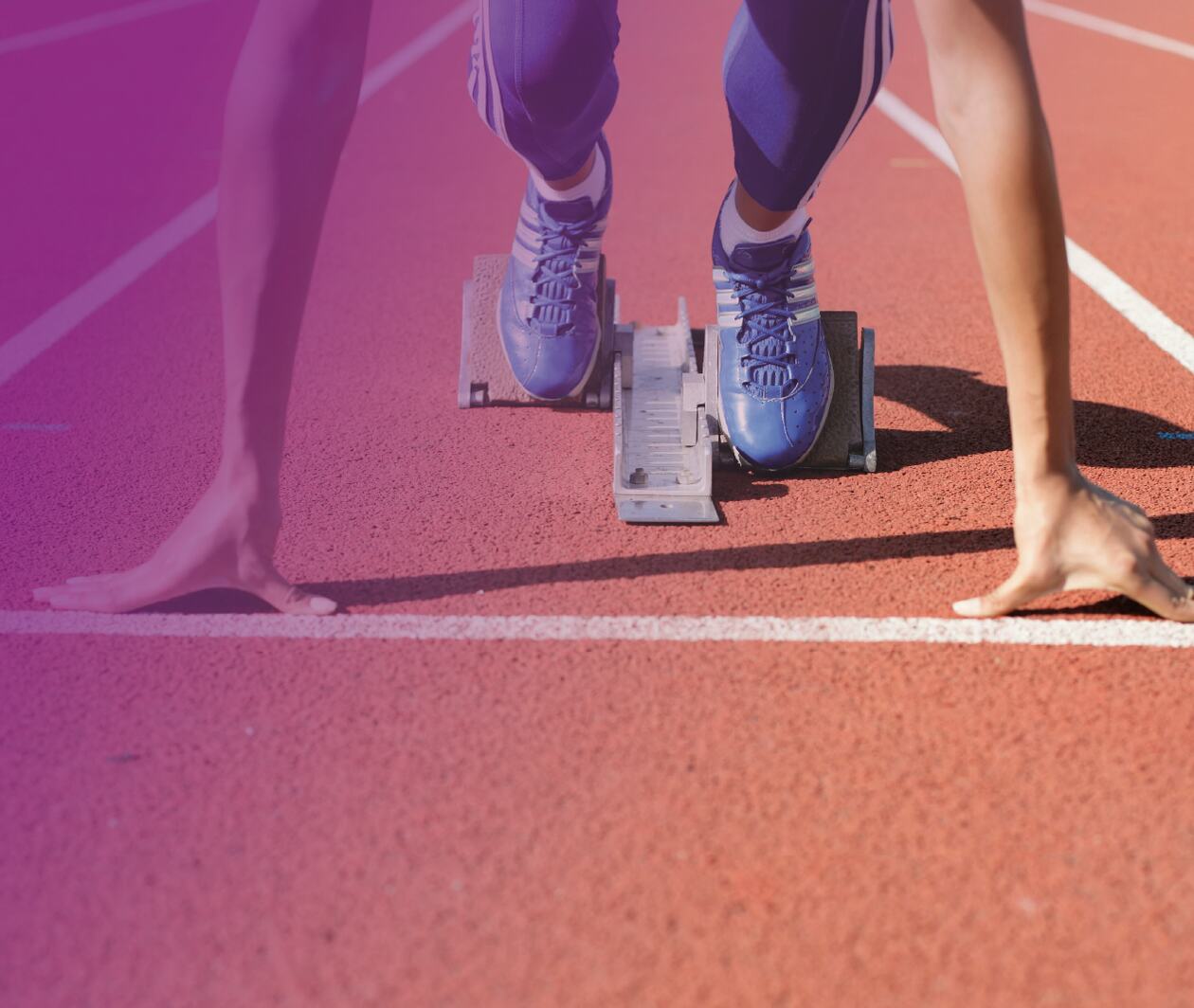 This image shows a runner getting ready for a run on a racetrack