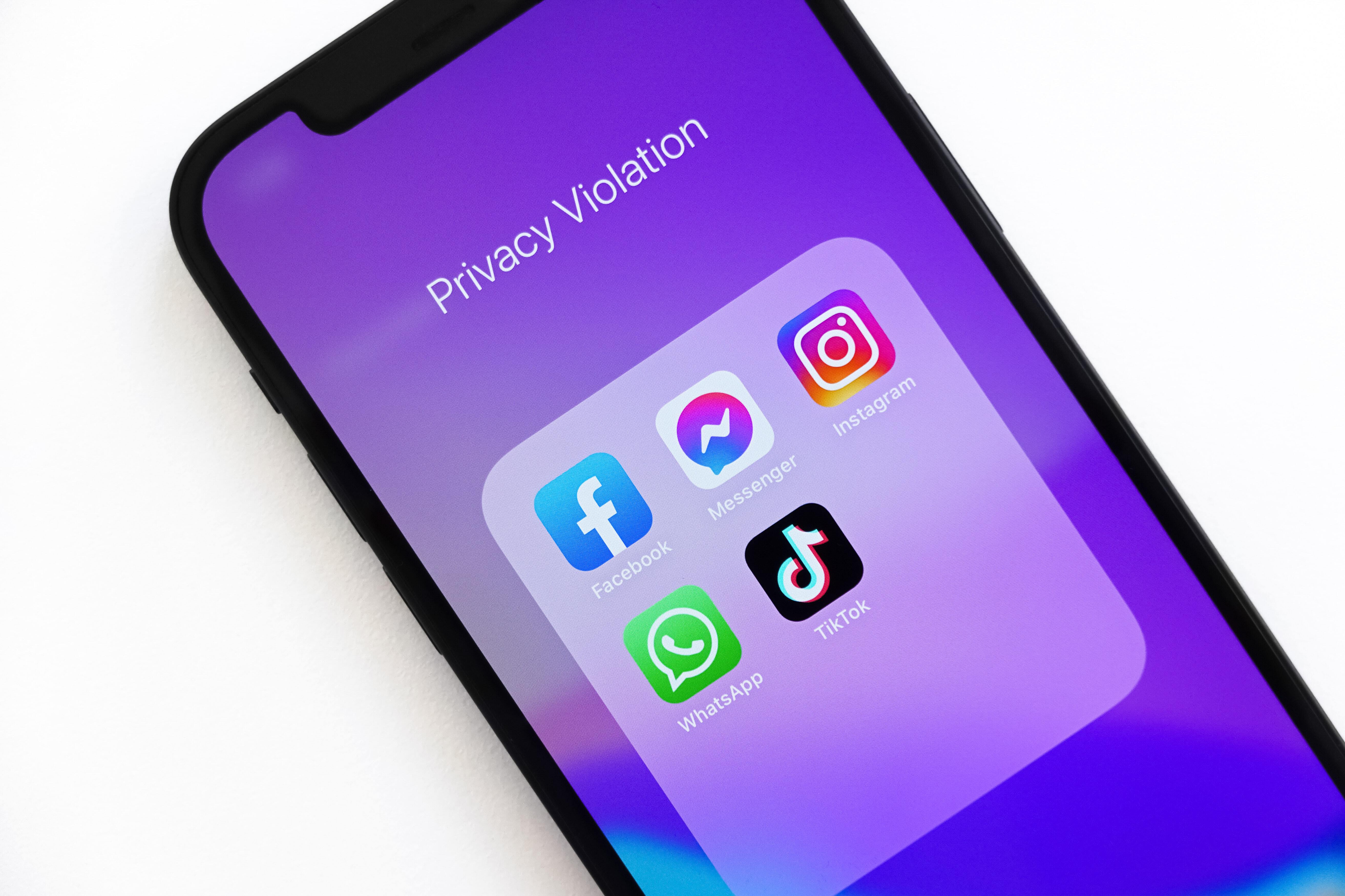 Phone displaying social media icons and privacy violation