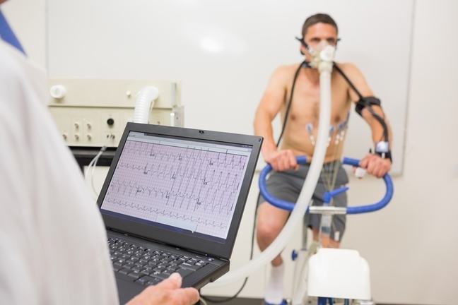 Male athlete on a sports science bicycle doing testing.