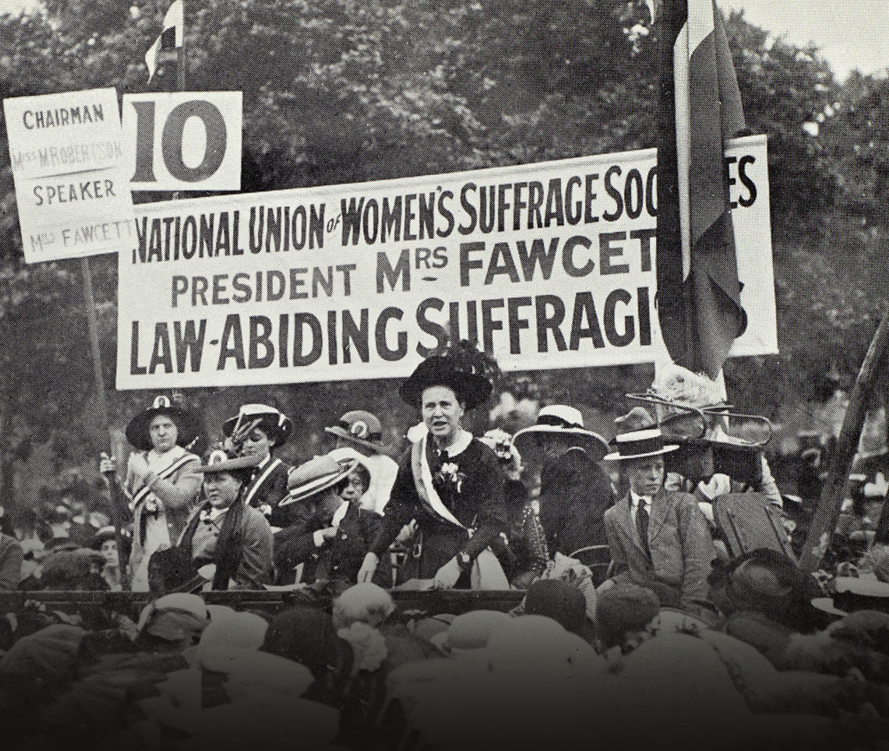 Millicent Fawcett, President of the National Union of Women’s Suffrage Societies, addressing a crowd in Hyde Park in 1913. The banner behinds Mrs Fawcett reads ‘Law-Abiding Suffragists’. 