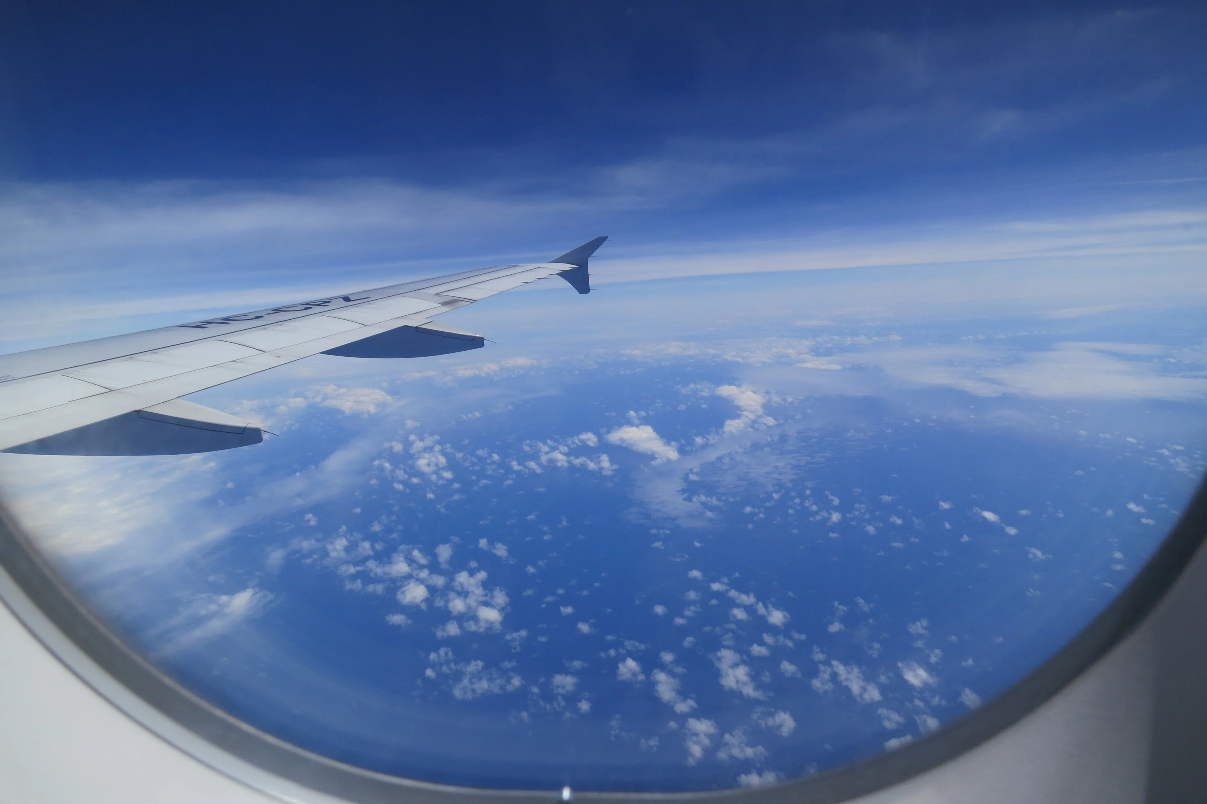 the view from the window of a plane in air