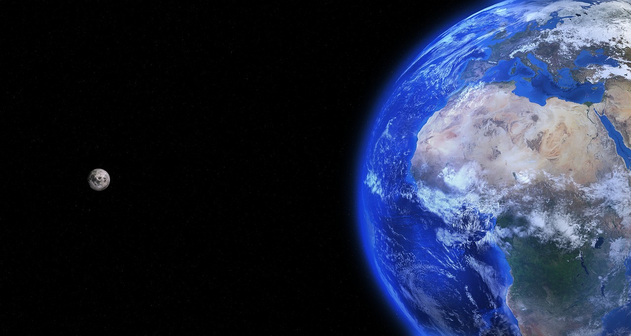 Image of Earth's physical and atmospheric boundary. The moon is in the distance, far out of the reach of the atmospheric boundary.