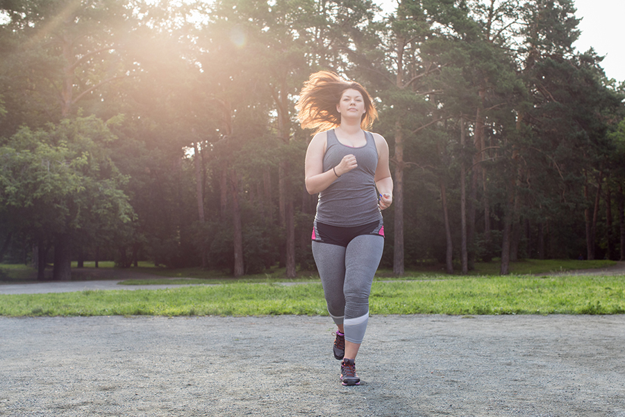 obese woman jogging