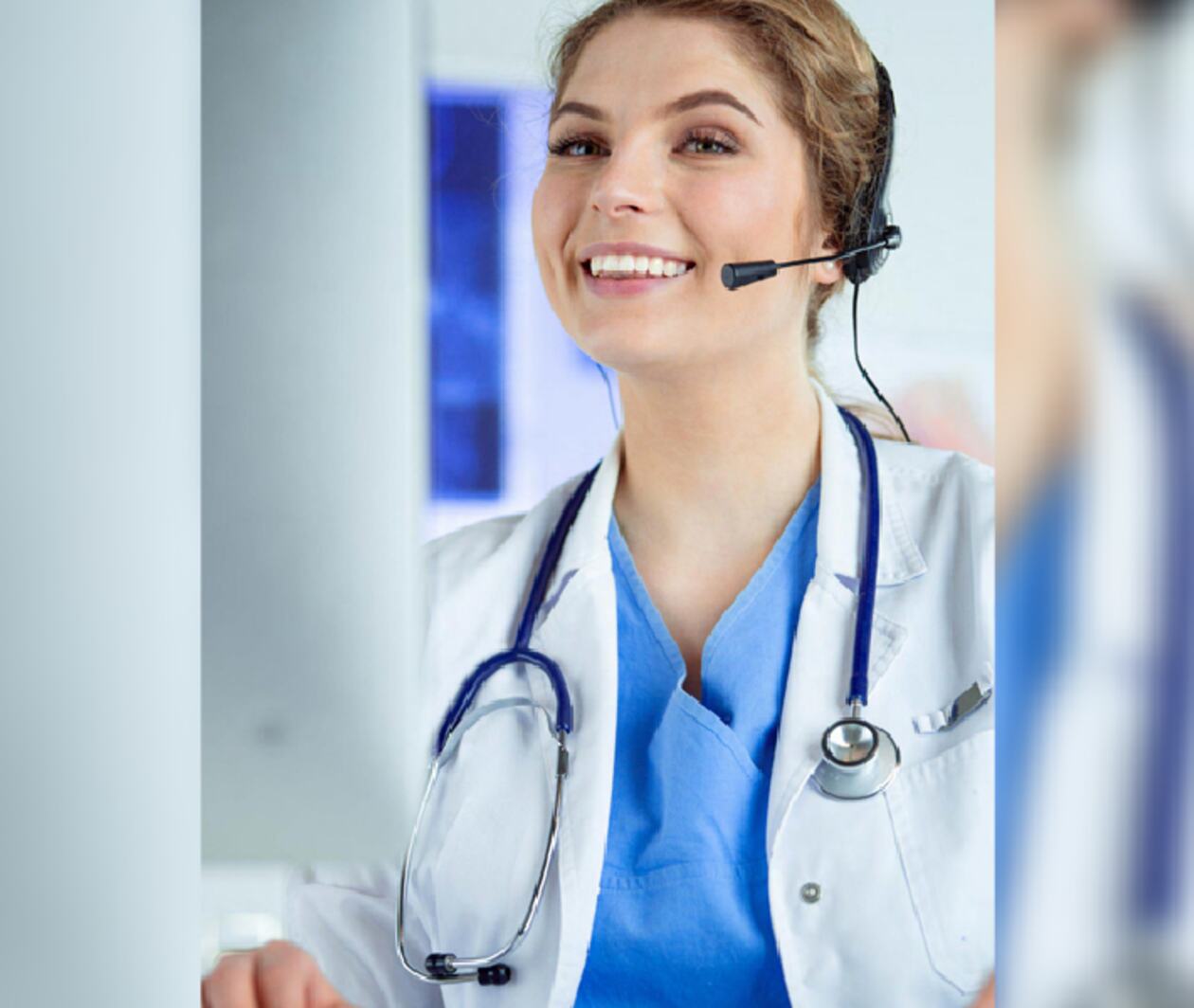 A veterinarian with a stethoscope around her neck, smiles while looking up