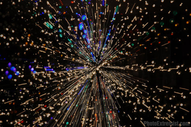 Ray of coloured lights moving from a central position outwards