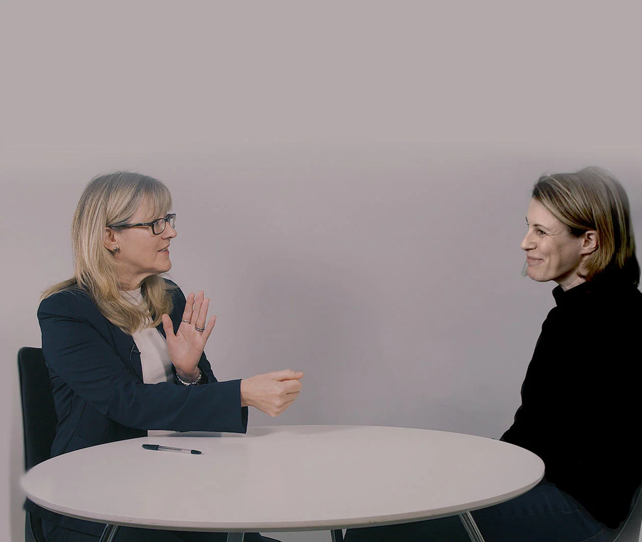 Genetic counselling in action showing a seated genetic counsellor facing and talking with a patient