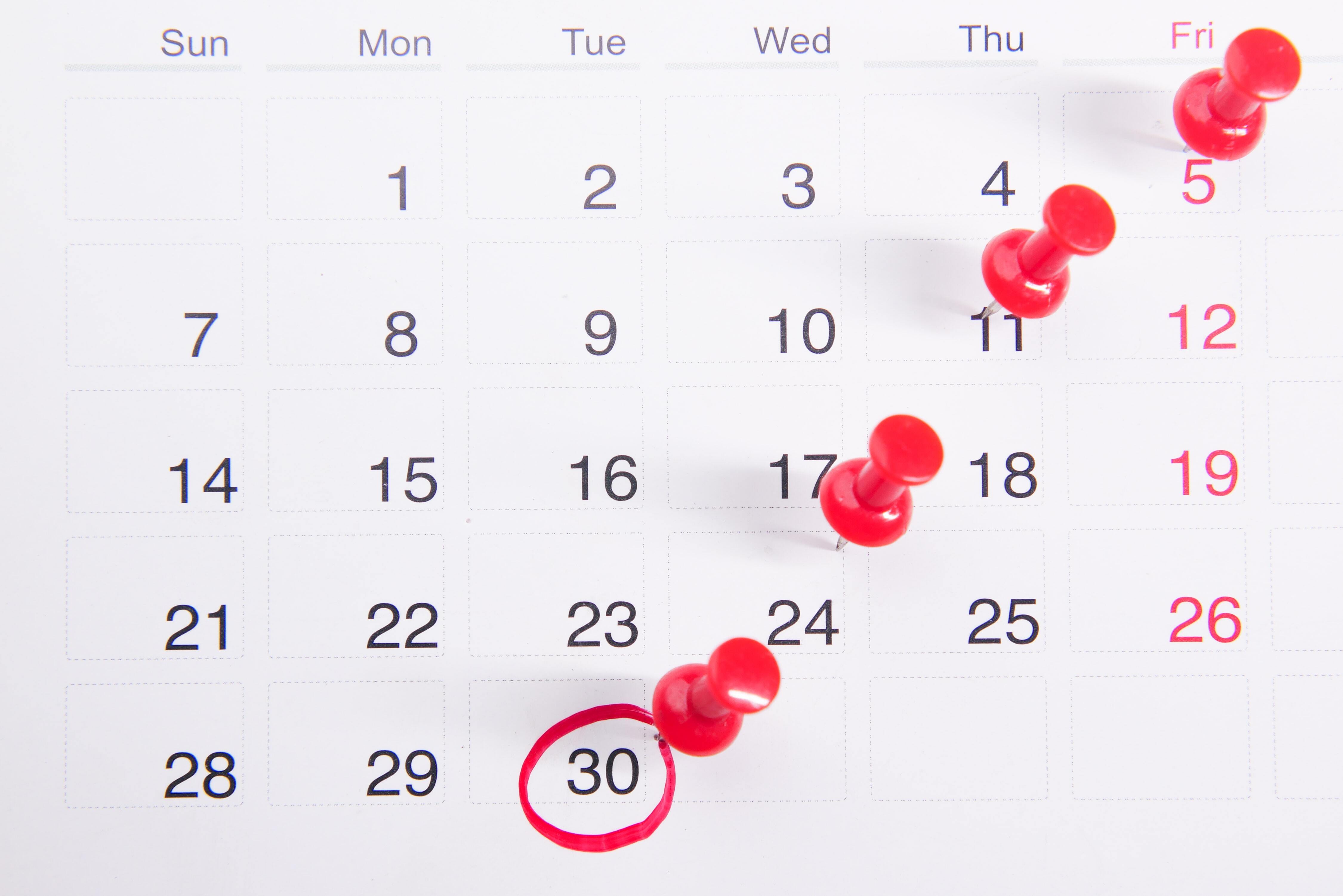 Red pins in a calendar