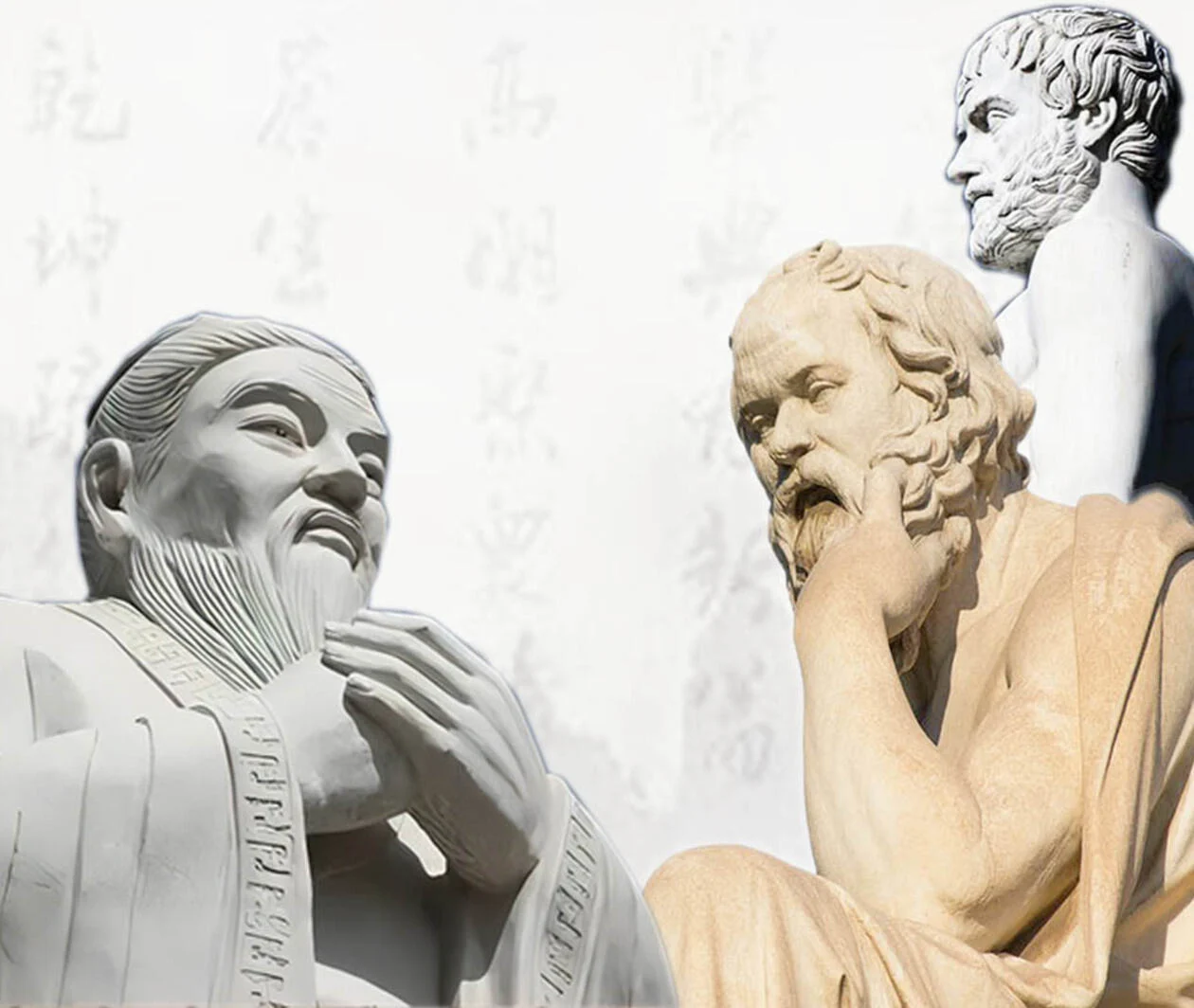 Three statues of ancient Chinese and Western philosophers against a backdrop of Chinese calligraphy.