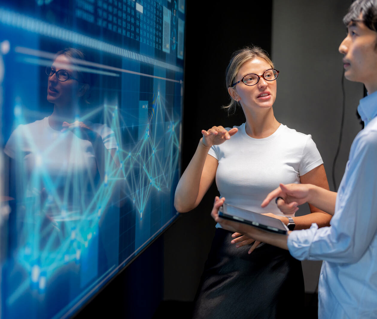 colleagues looking at a screen and analysing data
