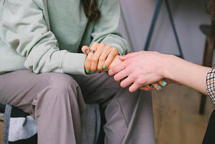 hands holding by patient and medic