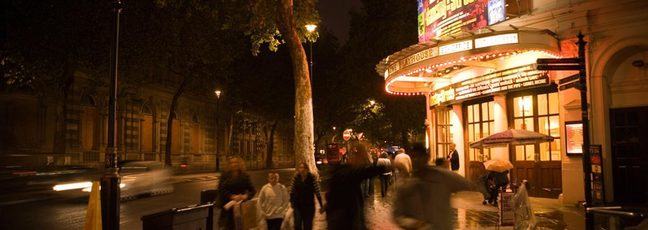 A busy street in London, England, at night