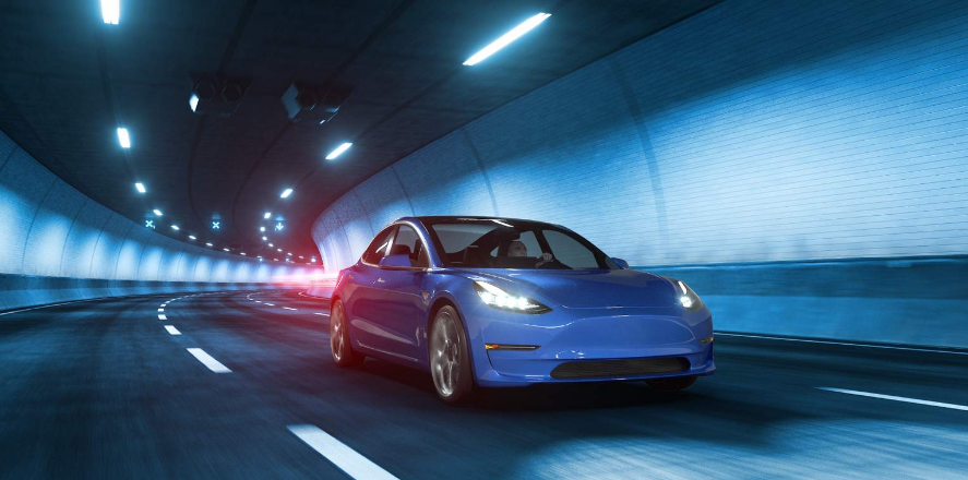 Tesla car drives through tunnel