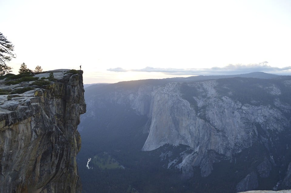 Someone is standing at the edge of a ravine.