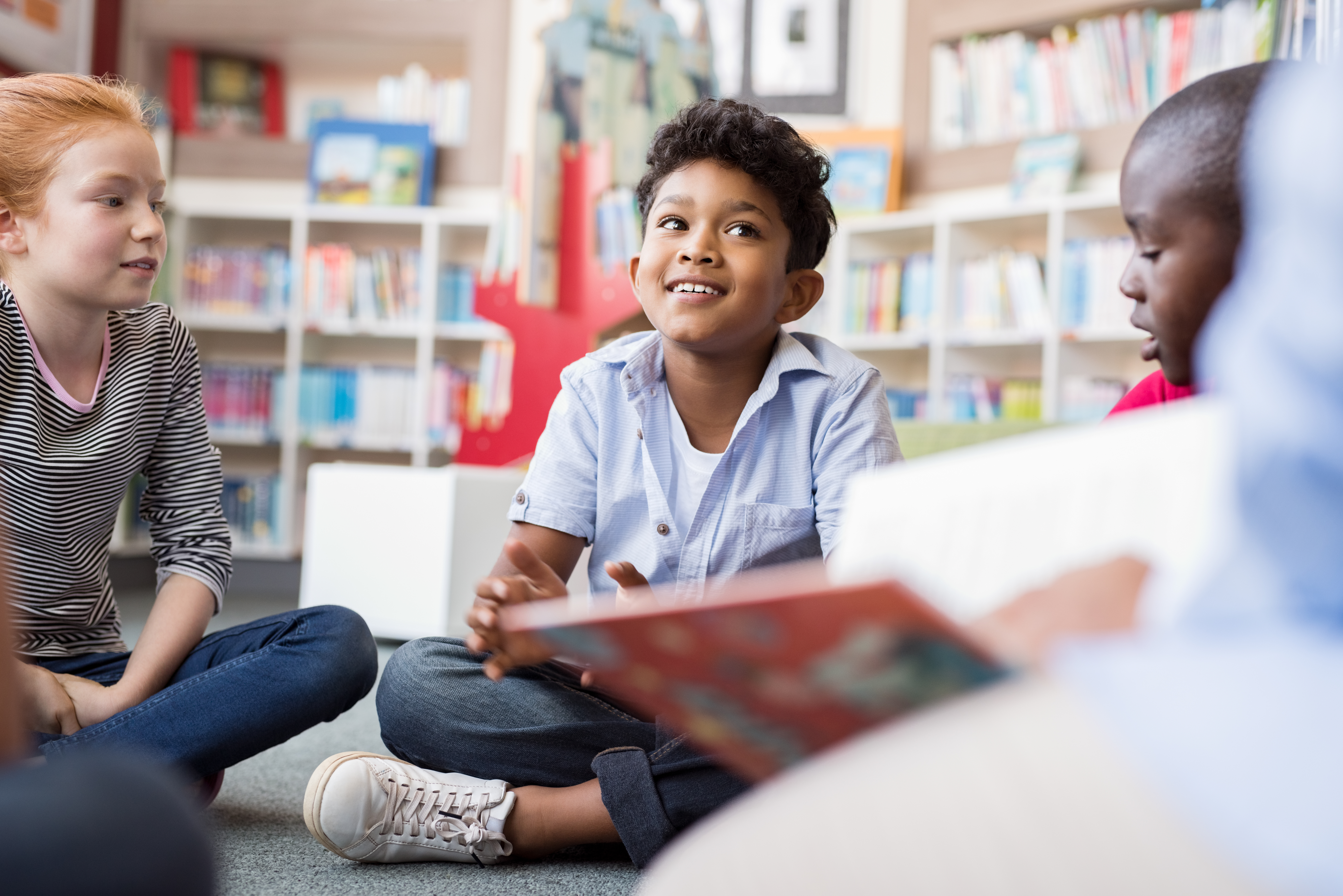 Children sat on the floor