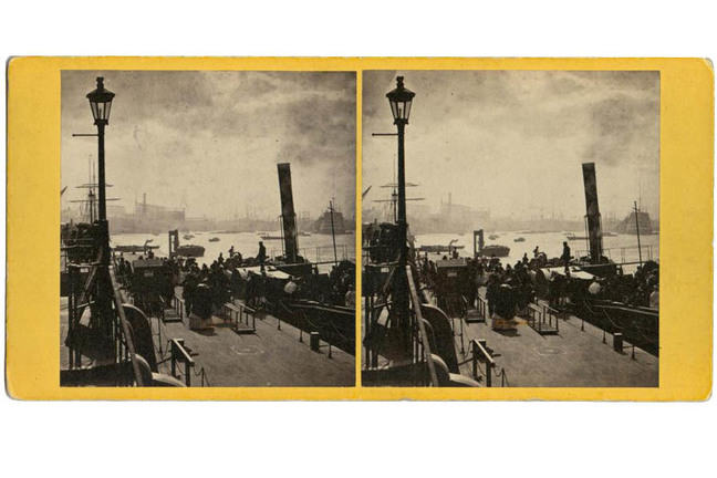 Stereocard depicting the arrival of a steam boat on the Thames at Greenwich, London with people on the pier.