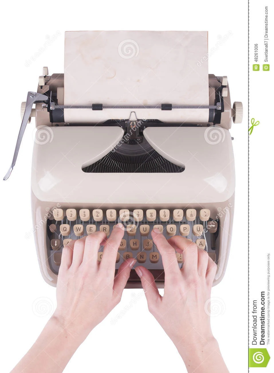 Photo of a pair of hands with fingers typing on an old manual typewriter, set on a white background