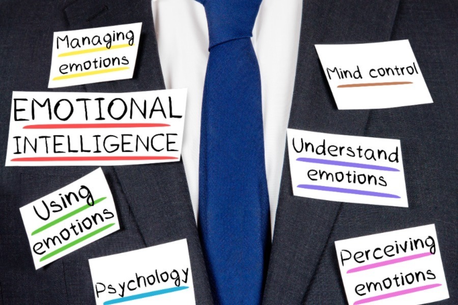 Man in suit with Post-Its that discuss emotional intelligence