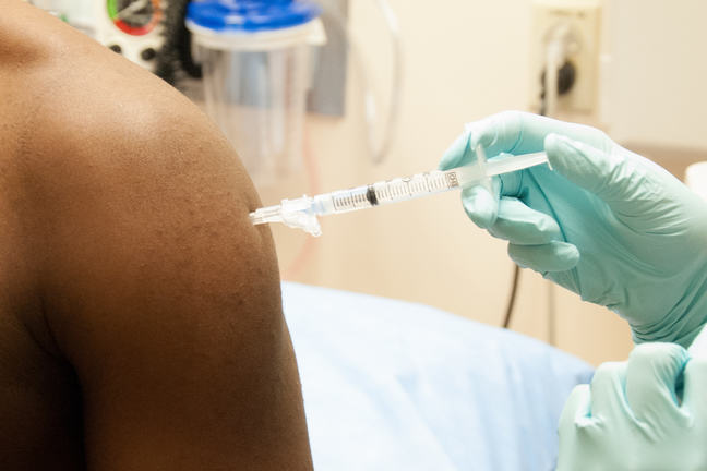 person being vaccinated
