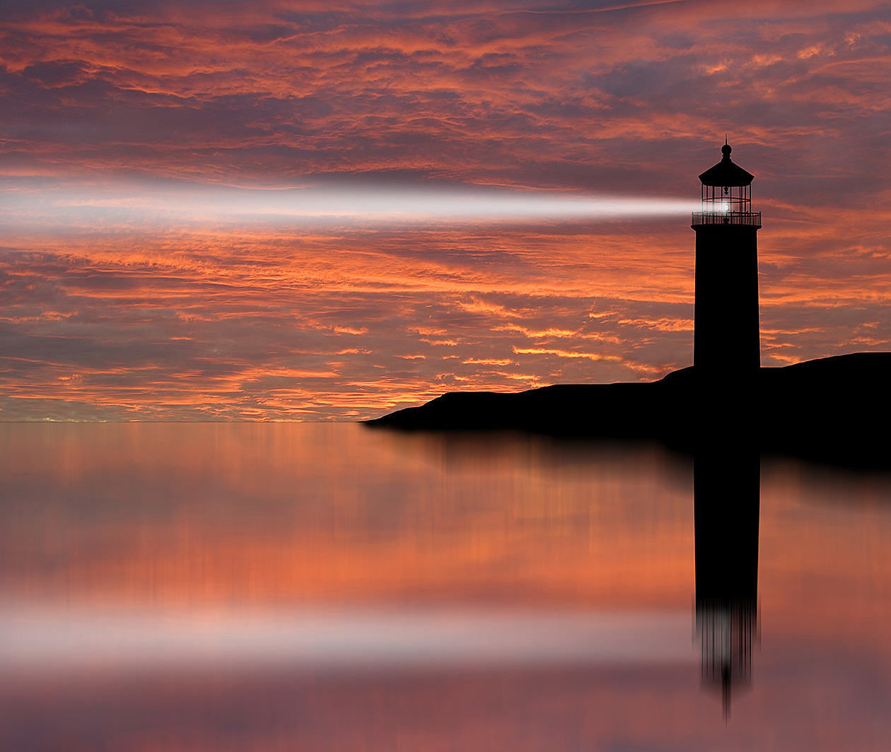 Image of lighthouse beam shedding light on local landscape