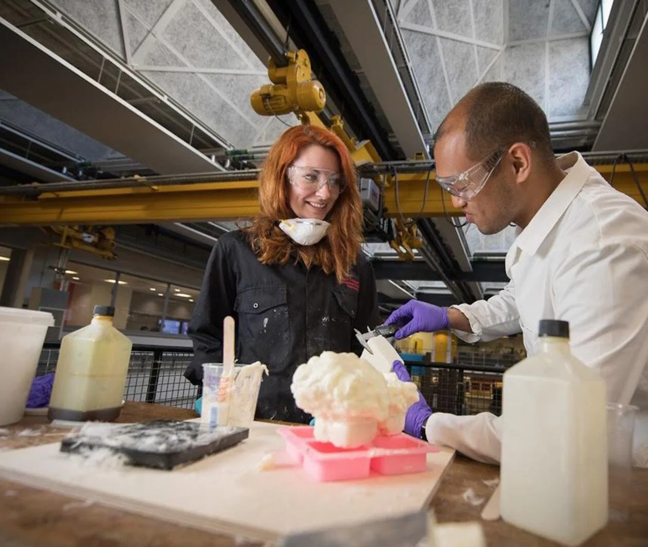 Decorative image, a man and a woman wear protective clothing while working with chemicals. Aeropowder 2016