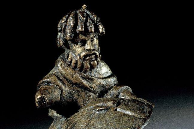 Copper-alloy figure of a horseman with dreadlocks, a drooping moustache and a full beard