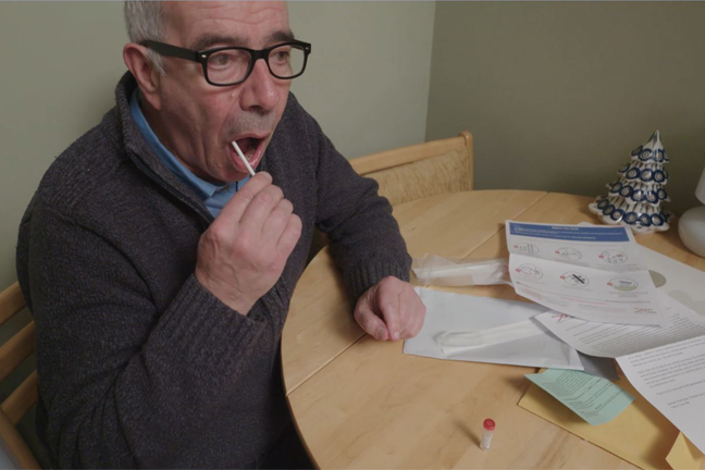 Man taking mouth swap for a DNA test