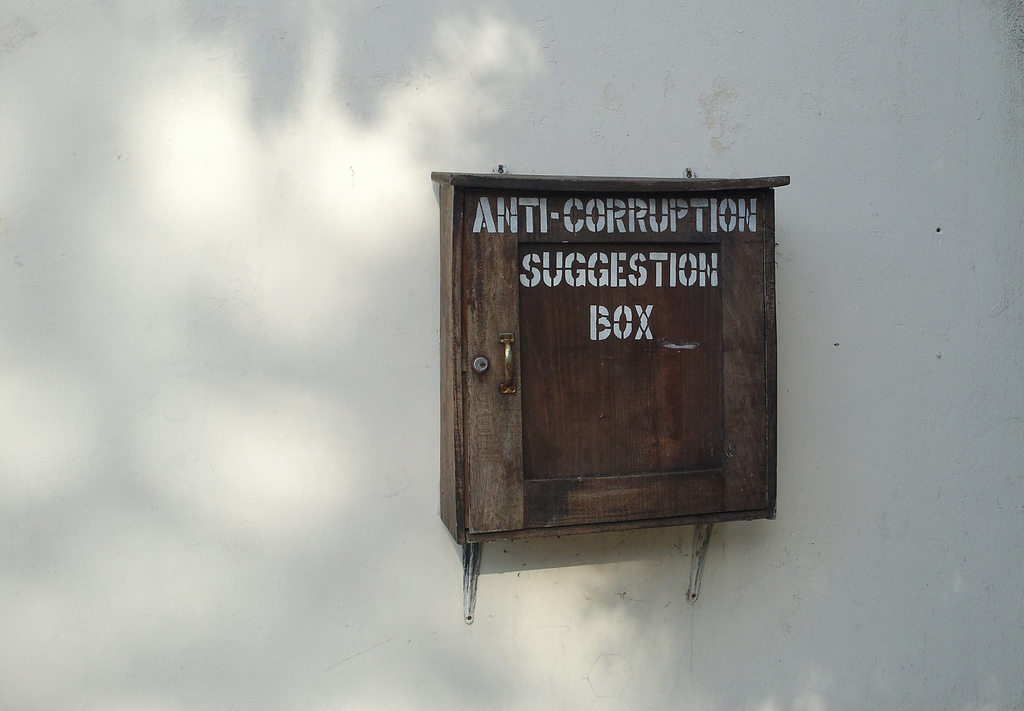 Box on wall with wording Anti corruption suggestion box