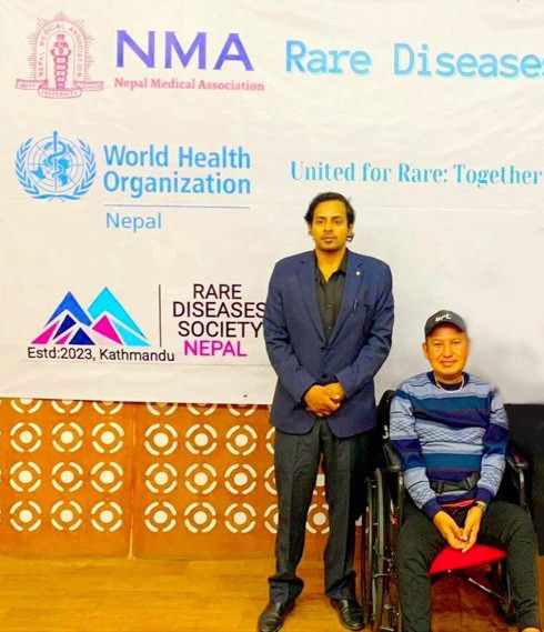 Dr Rupesh Mishra on the left with Mr Nirmal Khadka Stretched arm holding megaphone