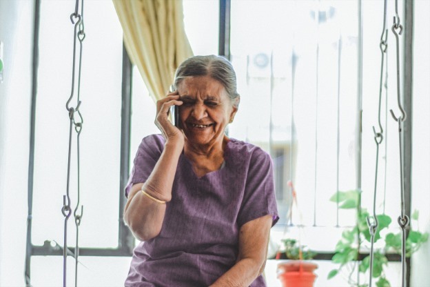 Lady on mobile phone smiling