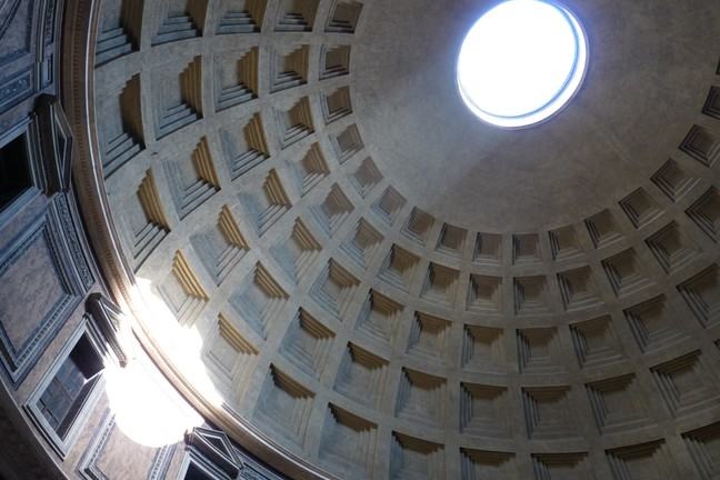 Dome ceiling showing carved squares and a hole at the top