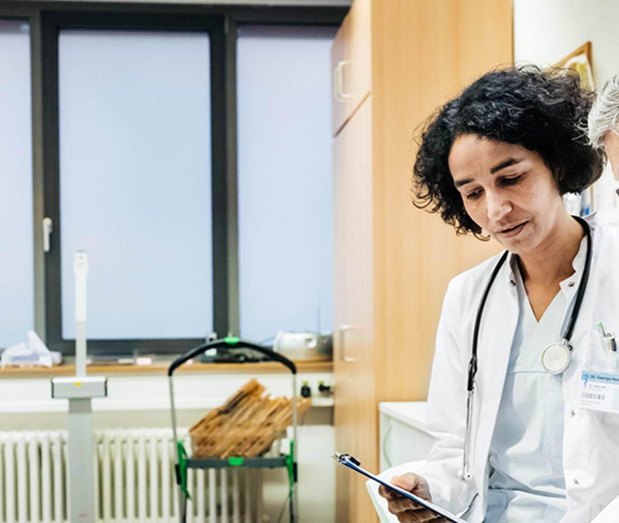 Elderly Man Talking To Doctor About Test Results