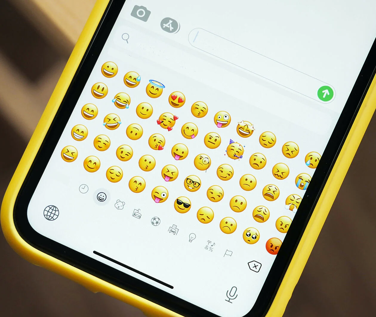 Phone showing a variety of emojis