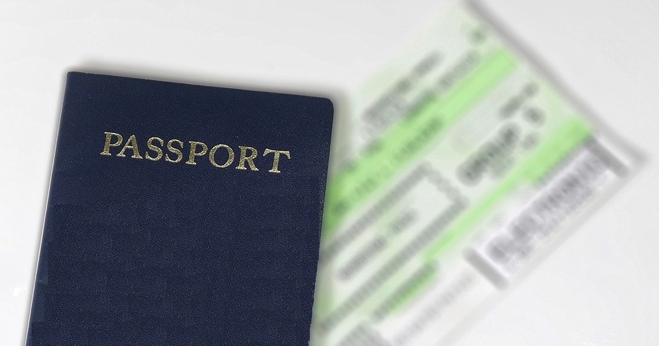 Passport and ticket (details blurred).