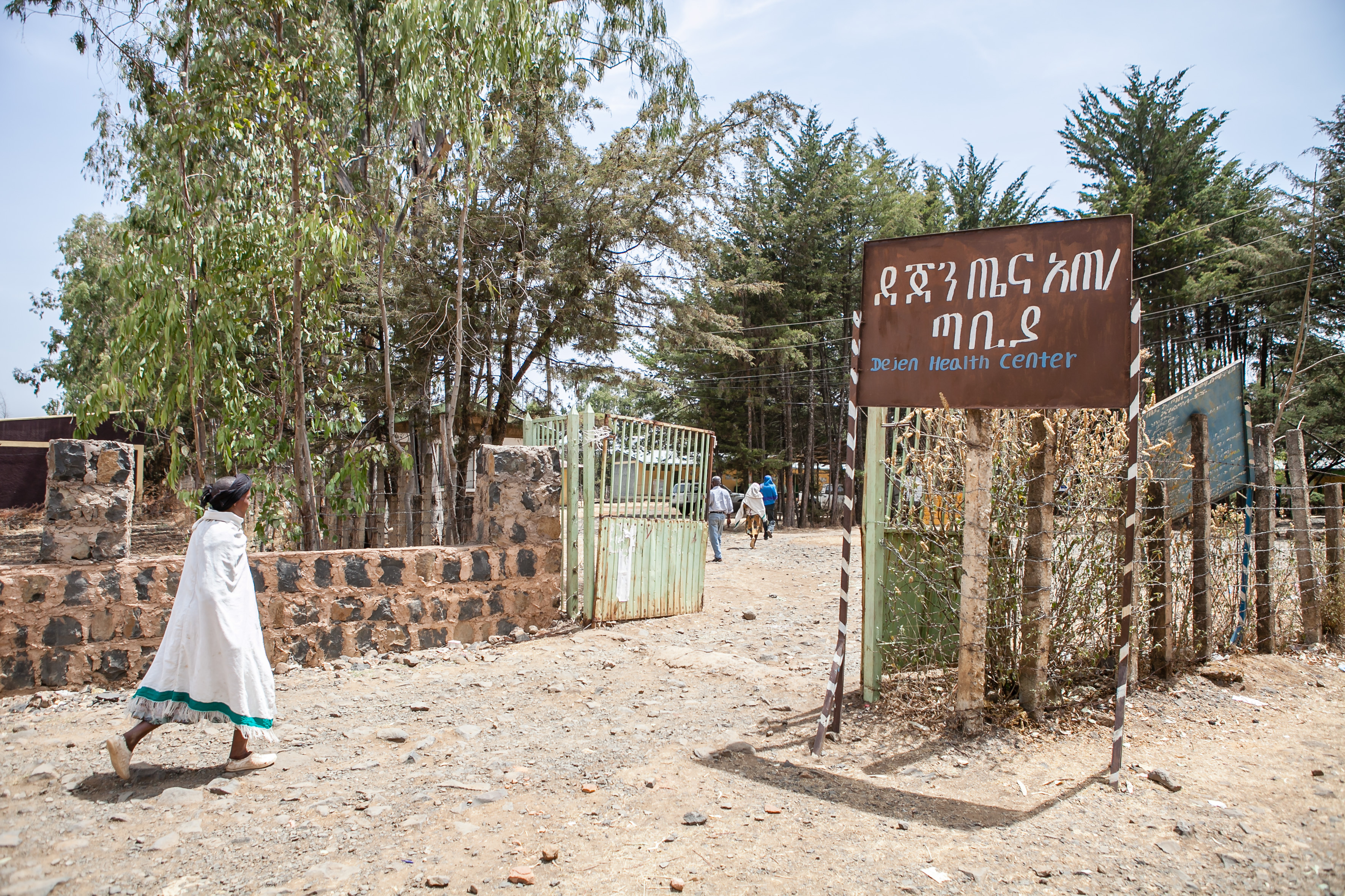 Image of a woman walking to a healthcare center in Ethiopia.