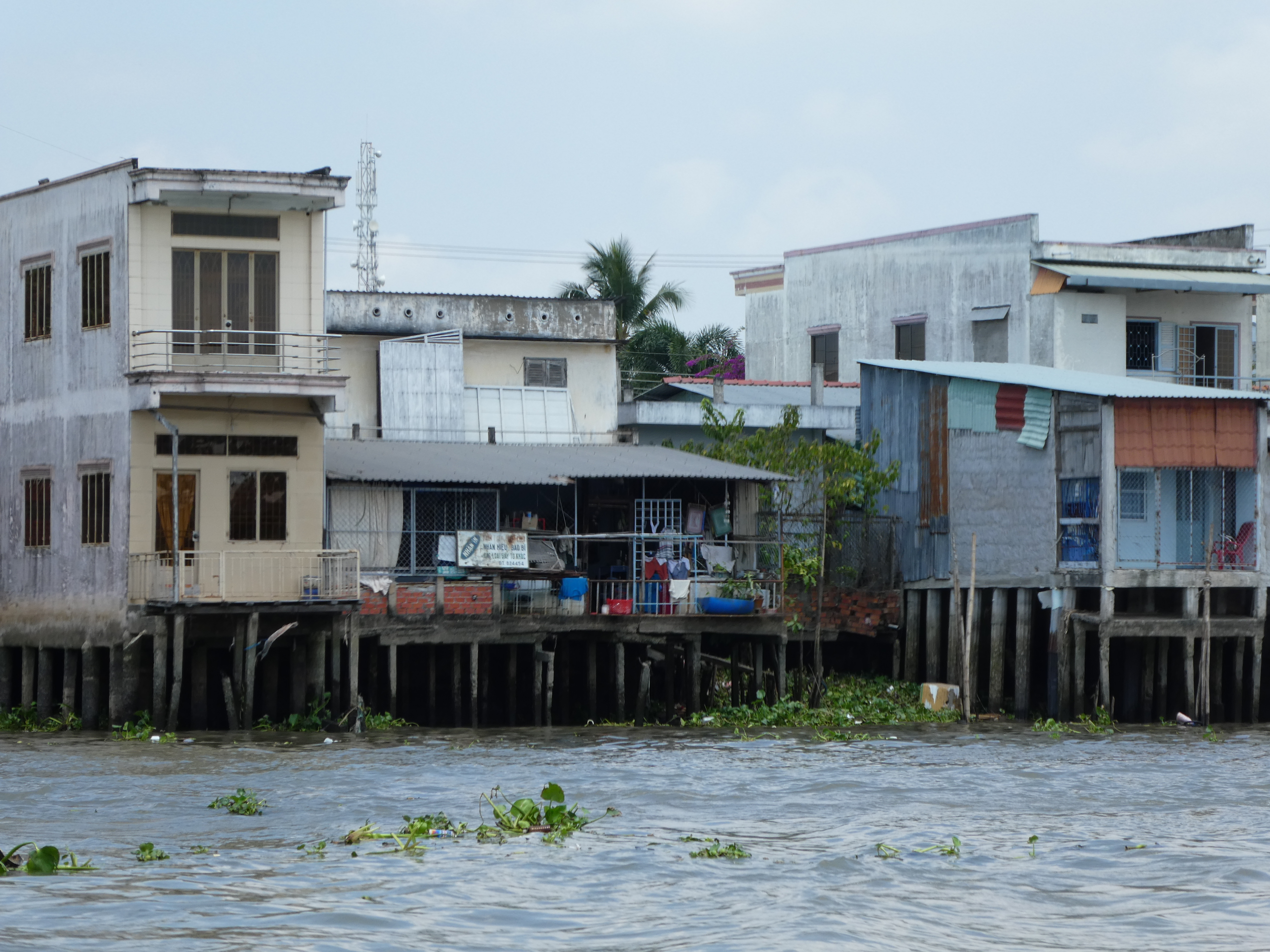 Buildings on stilts on a riverside