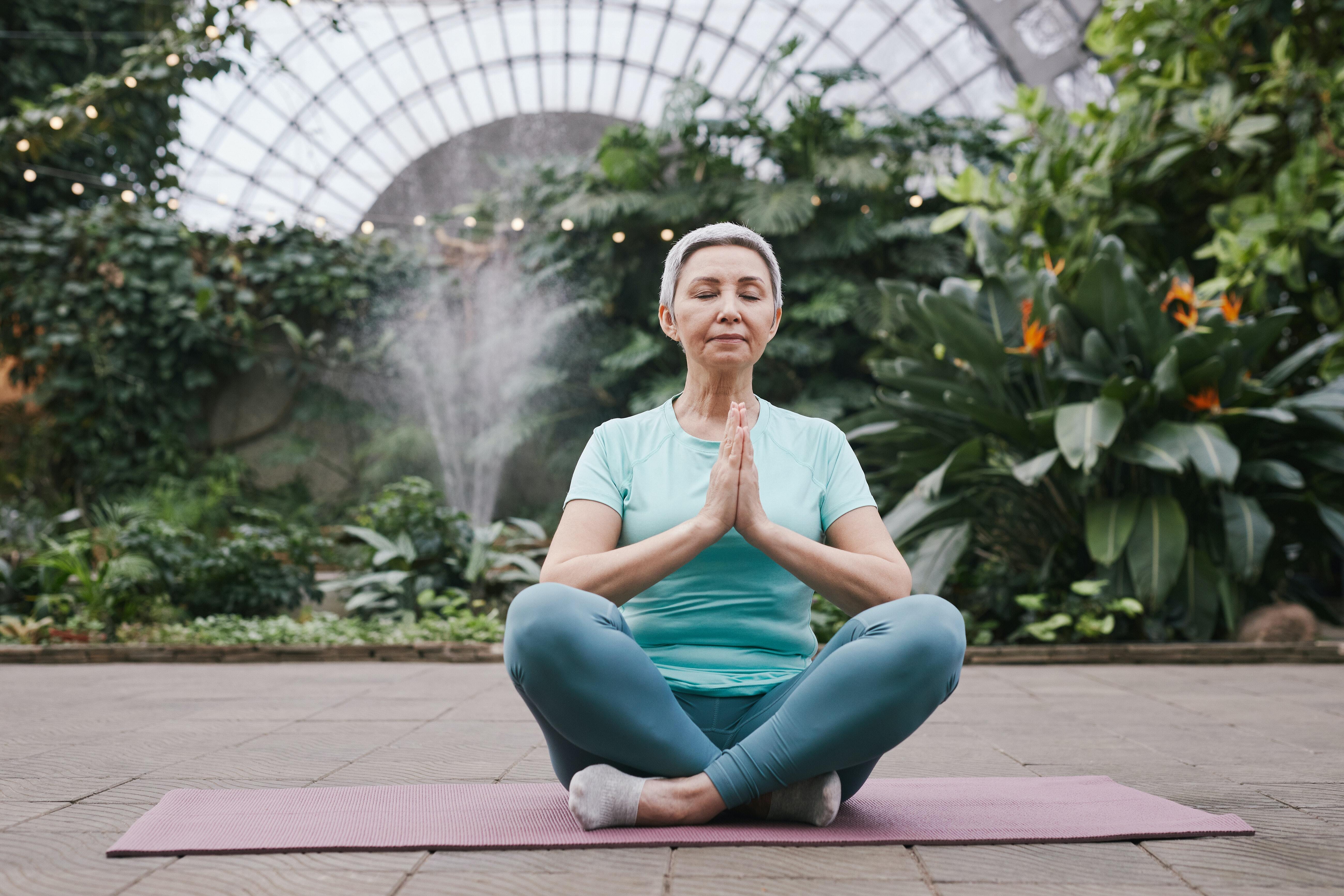 an older person practicing yoga