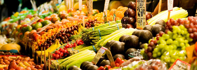 A market stall full of fresh fruit and vegetables, illustrating our need for food security