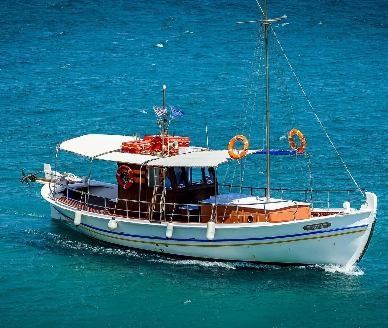 a white boat floating on top of a body of water, shutterstock, hurufiyya, pathos, vivid colors!, watch photo, fishing boat